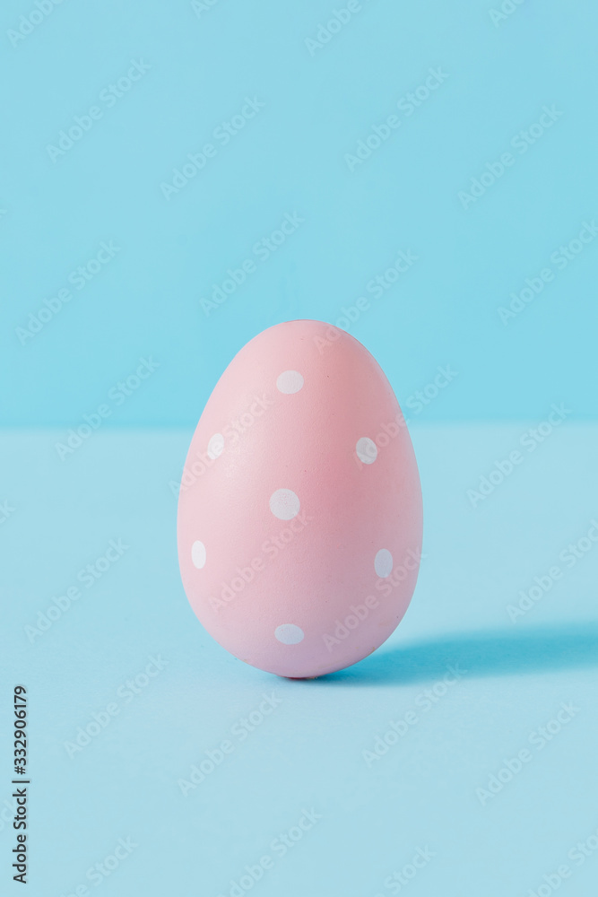 Creative composition pink Easter egg. Minimal spring or summer Holiday concept. Pastel fun background.