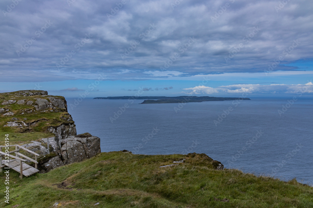 Rathlin Island viewed from Fairhead sea cliffs, Ballycastle, Causeway coast and glens, County Antrim, Northern Ireland Rathlin Island viewed from Fairhead sea cliffs, Ballycastle, Causeway coast and glens, County Antrim, Northern Ireland