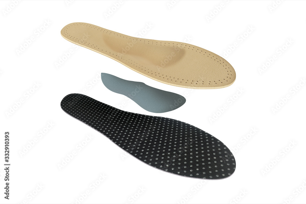Isolated orthopedic insole on a white background. Treatment and prevention of flat feet and foot diseases. Foot care, comfort for the feet. Wear comfortable shoes. Medical insoles. Isolated orthopedic insole on a white background. Treatment and prevention of flat feet and foot diseases. Foot care, comfort for the feet. Wear comfortable shoes. Medical insoles.