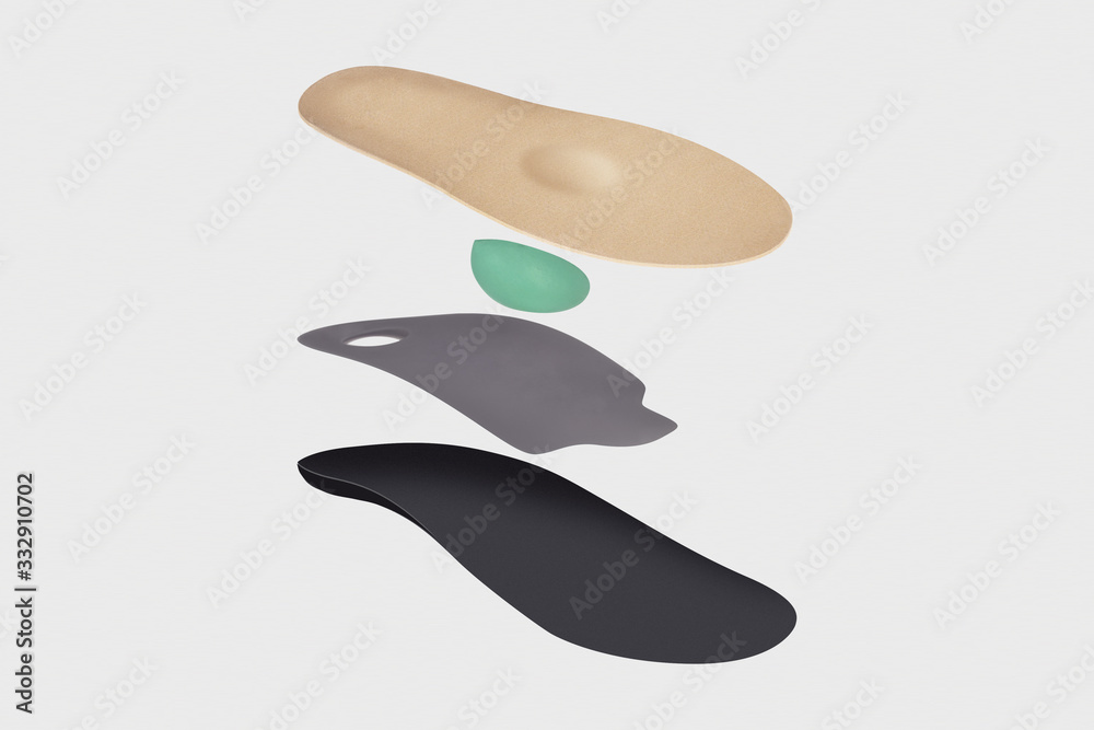 Isolated orthopedic insole on a white background. Treatment and prevention of flat feet and foot diseases. Foot care, comfort for the feet. Wear comfortable shoes. Medical insoles. Isolated orthopedic insole on a white background. Treatment and prevention of flat feet and foot diseases. Foot care, comfort for the feet. Wear comfortable shoes. Medical insoles.