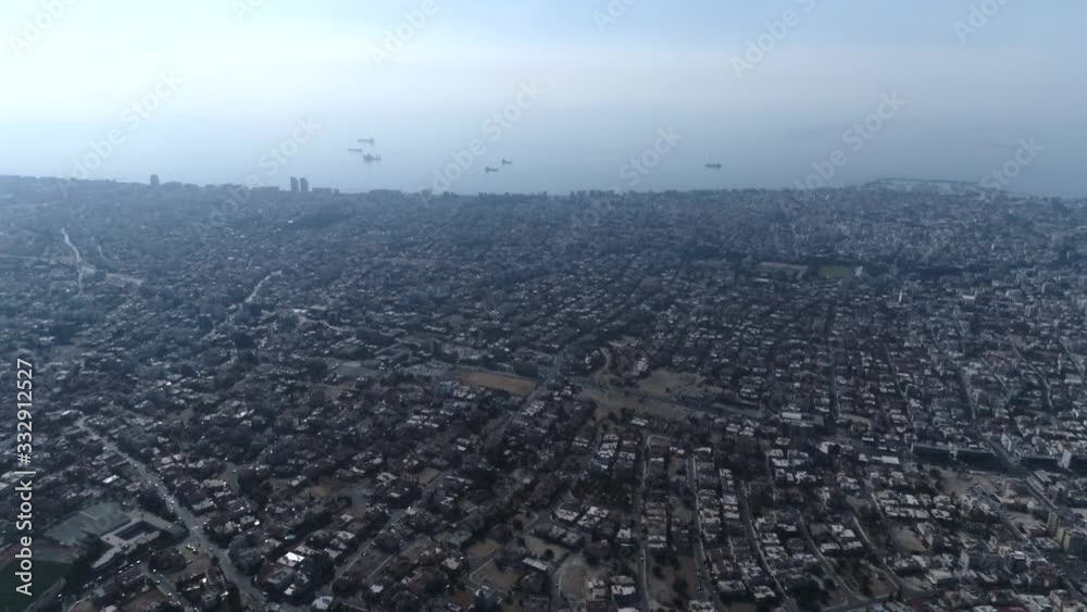 Limassol city at sunrise, cityscape and sea view with ships and horizon line, dawn, beautiful light, golden hour. Aerial footage Limassol city at sunrise, cityscape and sea view with ships and horizon line, dawn, beautiful light, golden hour. Aerial footage