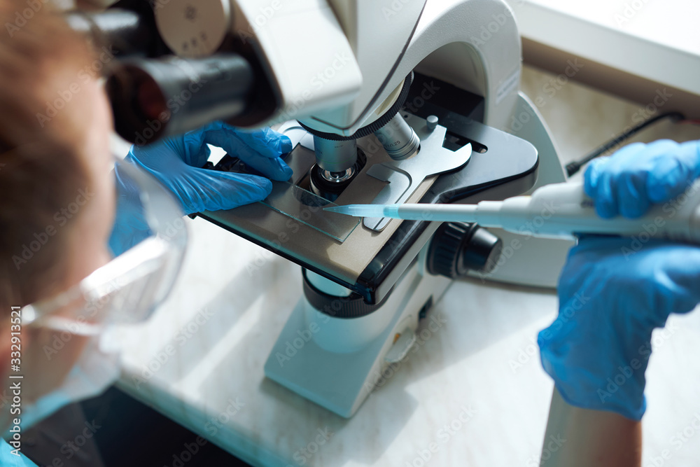 laborant working with microscope laborant working with microscope