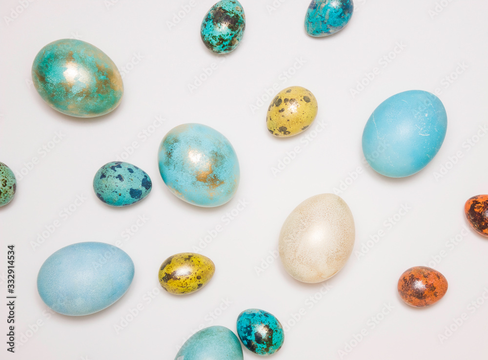 Blue colored Easter eggs with gold elements on a white background. Minimalism. Happy Easter!