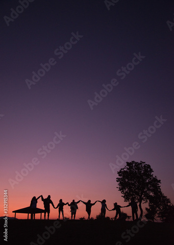 silhouettes of people on a sunset