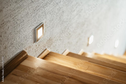 Modern wooden staricase with lights