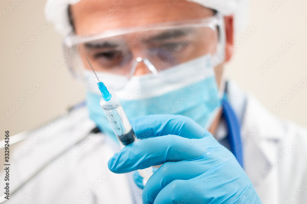 caucasian doctor with syringe caucasian doctor with syringe