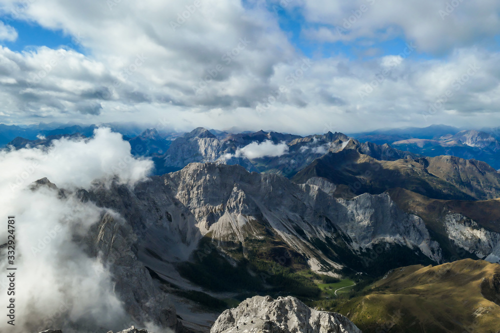 View from the top of Monte Coglians, Hohe Warte on the Austrian-Italian Alpine border.There are endless mountain chains visible. Happiness and achievement. Overcast