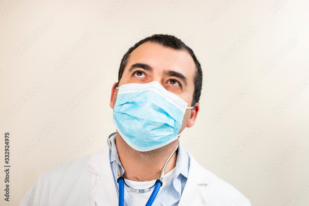 caucasian doctor with stethoscope and face mask caucasian doctor with stethoscope and face mask
