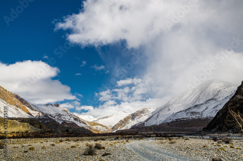 Trekking route between Jomsom and Marpha villages in winter sunny day. Kali Gandaki valley, Annapurna circuit / Jomsom trek, Nepal. photo