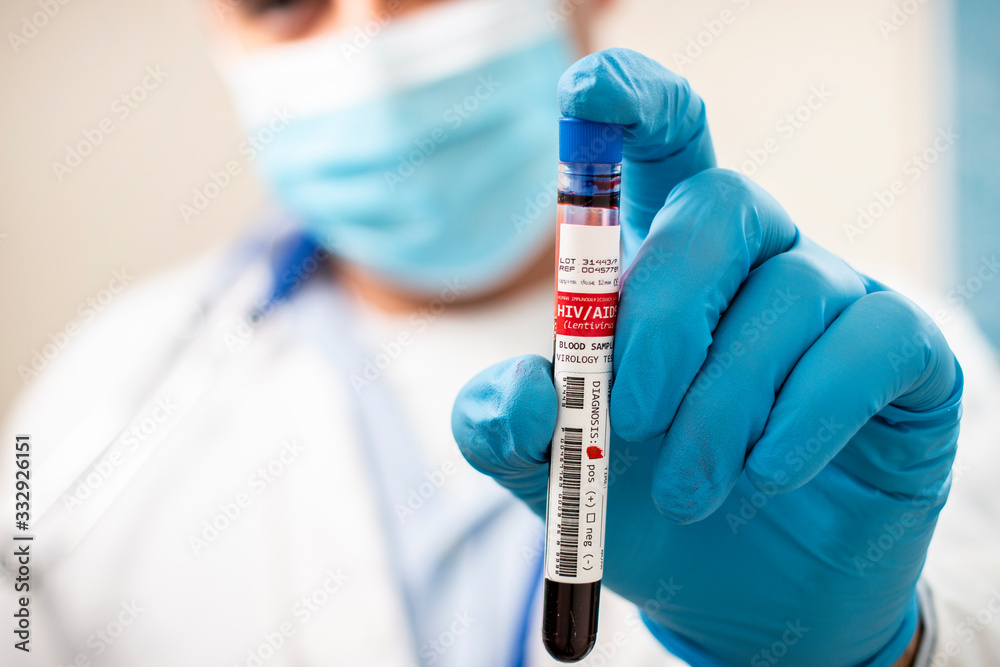 Doctor holding test tube blood sample Doctor holding test tube blood sample