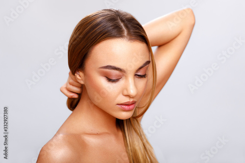 Studio portrait of a beautiful young woman with perfect fresh clean skin