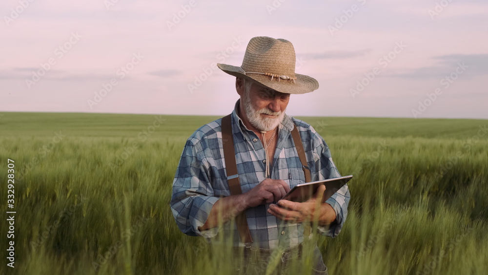 Farmer Uses A Digital Device. Agriculture, Farming Concept. Farmer Uses A Digital Device. Agriculture, Farming Concept.