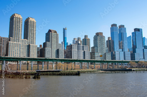 Skyscrapers in the Lincoln Square New York City Skyline along the Hudson River on a Clear Blue Day