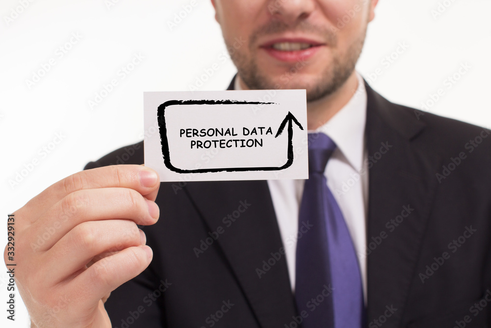 Business, Technology, Internet and network concept. Young businessman working on a virtual screen of the future and sees the inscription: Personal data protection Business, Technology, Internet and network concept. Young businessman working on a virtual screen of the future and sees the inscription: Personal data protection