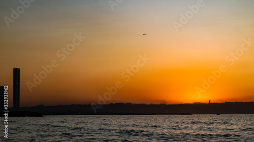 Sunset behind algiers city and the great mosque of algeria