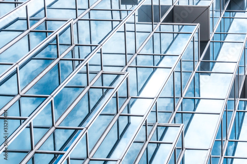 underside panoramic and perspective view to steel blue glass high rise building skyscrapers, business concept of successful industrial architecture