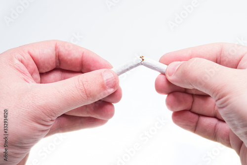 Broken cigarette in hands