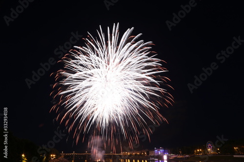 Salute on city day in Tver on the background of the bridge over the Volga river