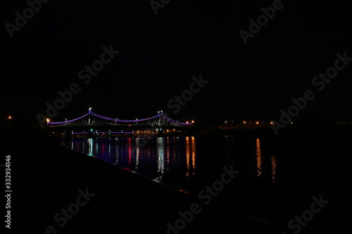 Salute on city day in Tver on the background of the bridge over the Volga river