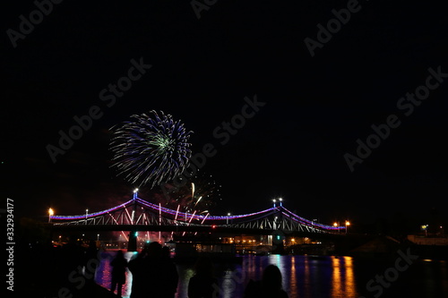 Salute on city day in Tver on the background of the bridge over the Volga river