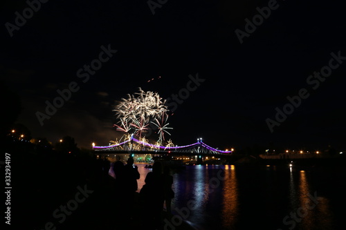 Salute on city day in Tver on the background of the bridge over the Volga river