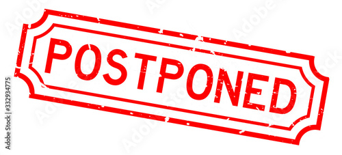 Grunge red postponed word rubber seal stamp on white background