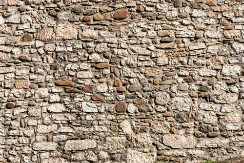 Close-up of a wall made with river pebbles and irregular shaped stones  full frame  background. Trento  Trentino Alto Adige  Italy  Europe