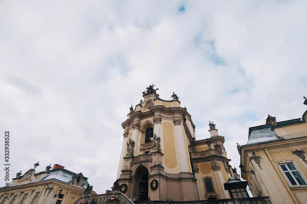 The roof of the Cathedral of St. George in Lviv. Sculpture of a horseman with a spear on a horse. Rococo style, Greek Catholic shrine. Wide angle.