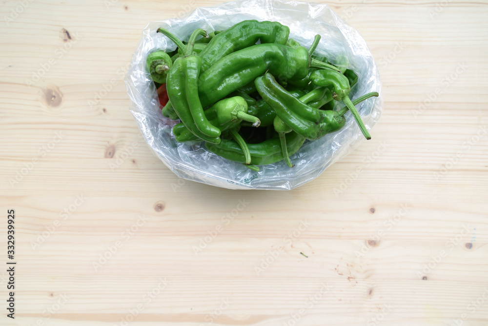 Fresh BIO Green Peppers on Wooden Table
Fresh BIO Green Peppers on Wooden Table