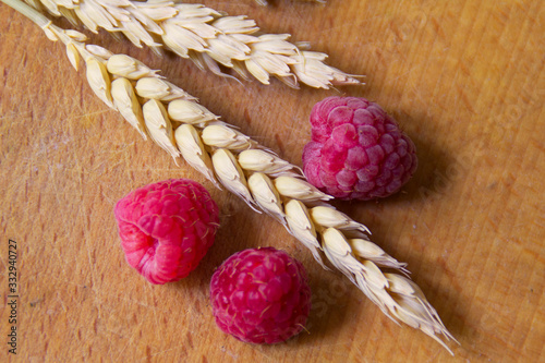 raspberry berries close-up on a wooden background