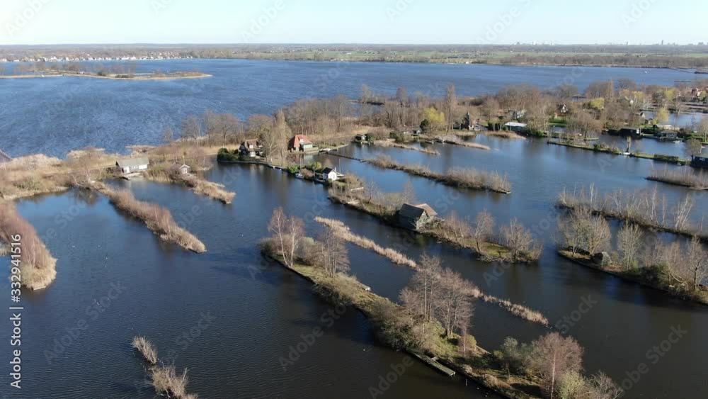 4k cinematic aerial video of dutch houses built on very small islands