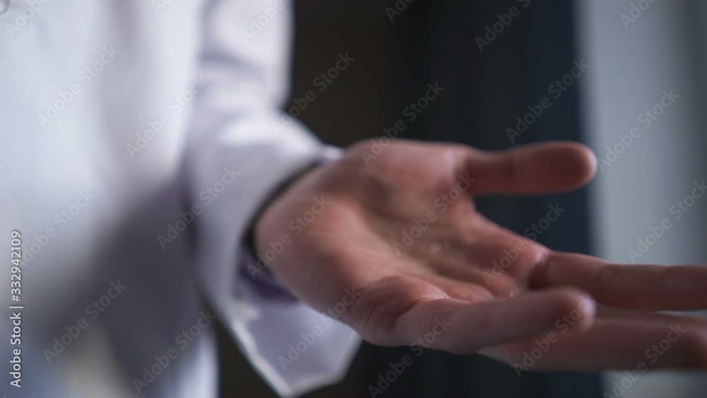 doctor uses a hand gel disinfectant to protect hands from coronavirus. doctor uses a hand gel disinfectant to protect hands from coronavirus.