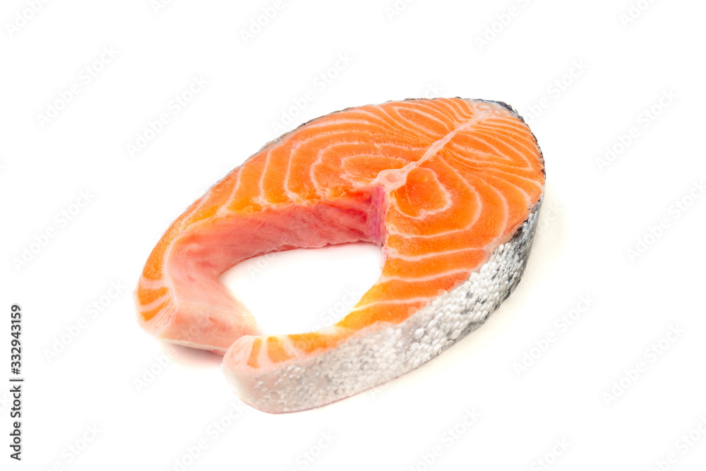 Fresh uncooked red fish steak over white Fresh uncooked red fish steak over white