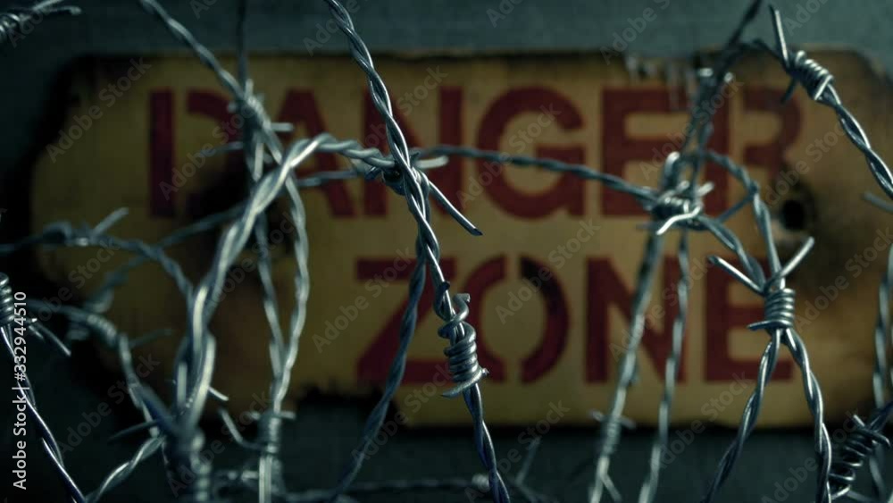 Danger Zone Sign Behind Barbed Wire