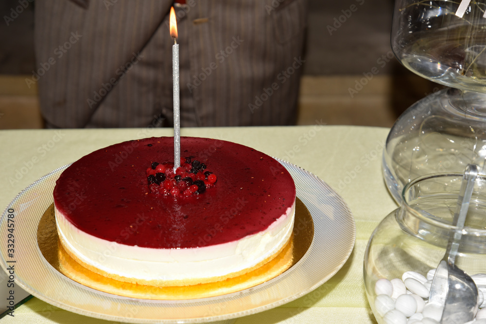 Bithday Cheesecake on the Table With Candle On Bithday Cheesecake on the Table With Candle On