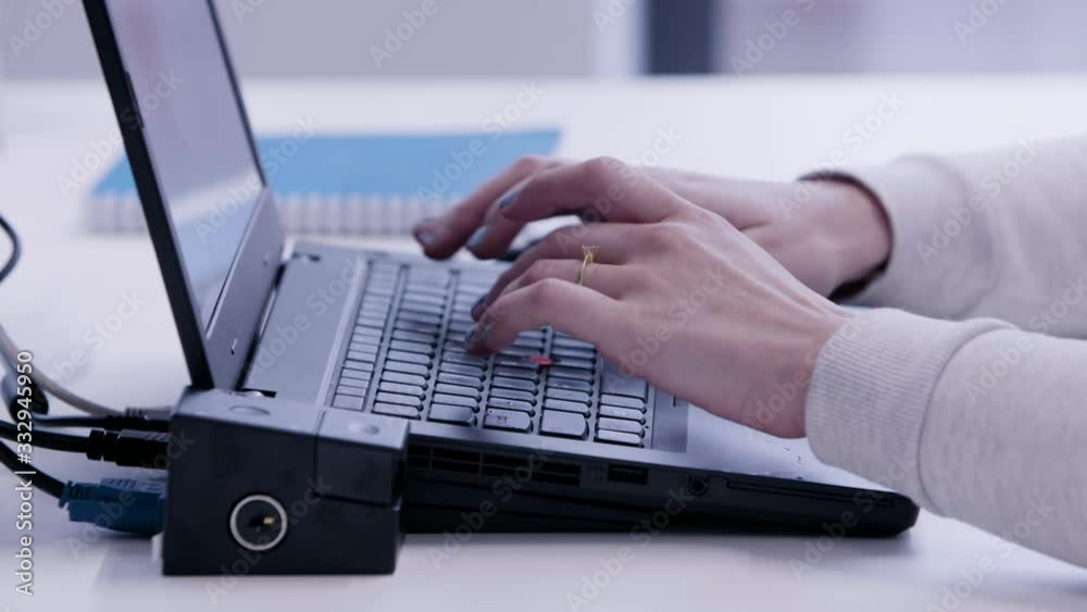 Woman working from home on her laptop. Manicure hands Woman working from home on her laptop. Manicure hands