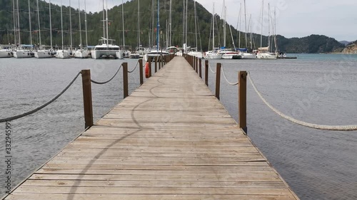 Orhaniye, Marmaris - Mugla / Turkey. March 09, 2020. A walk at pier on a windy day. photo