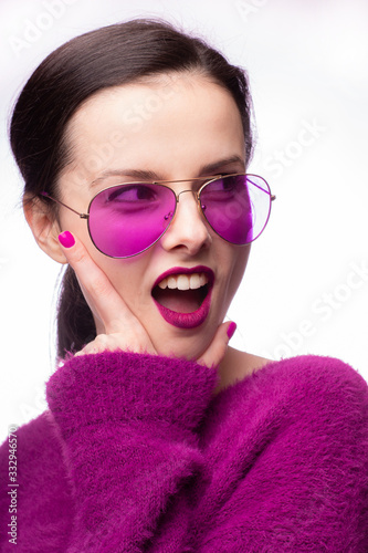 girl in a purple sweater, purple glasses with purple lipstick on her lips © Диана Шиловская