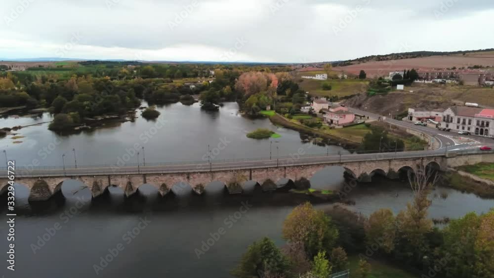 Pan Left Aerial Shot Over River Tormes At Alba De Tormes, Province Of Salamanca, Spain. Pan Left Aerial Shot Over River Tormes At Alba De Tormes, Province Of Salamanca, Spain.
