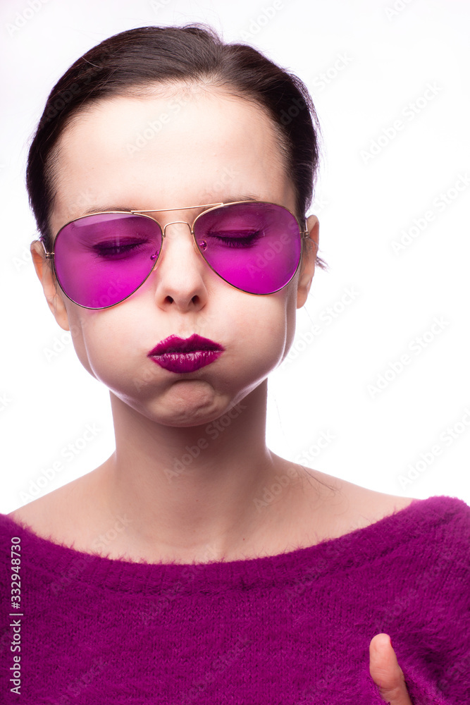 girl in a purple sweater, purple glasses with purple lipstick on her lips girl in a purple sweater, purple glasses with purple lipstick on her lips