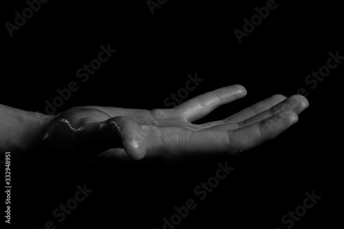 hands on black background