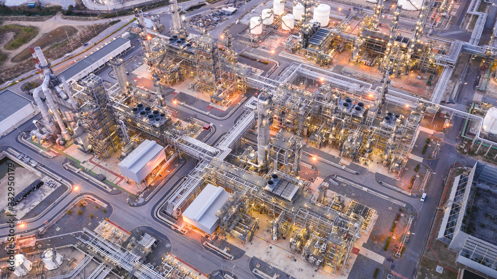 Aerial view of Oil refinery plant in twilight time, Petrochemical industry is important to the global economy.