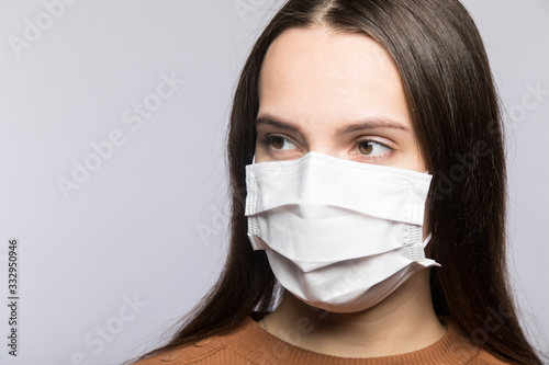 Stop coronavirus infection. The girl in the mask.