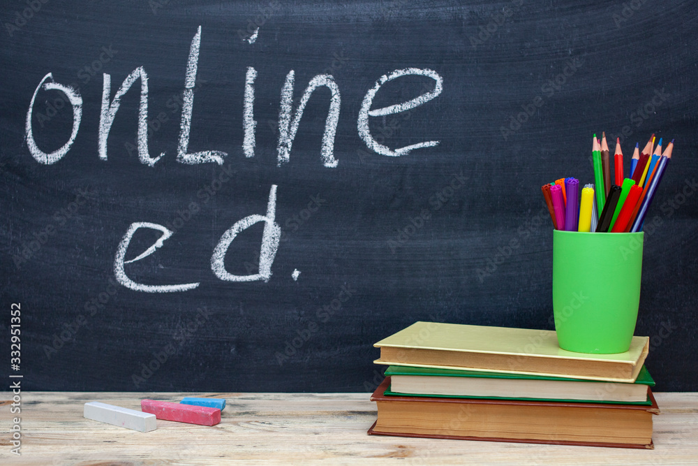 online education text in white chalk handwriting on a chalkboard. The concept of online education online education text in white chalk handwriting on a chalkboard. The concept of online education