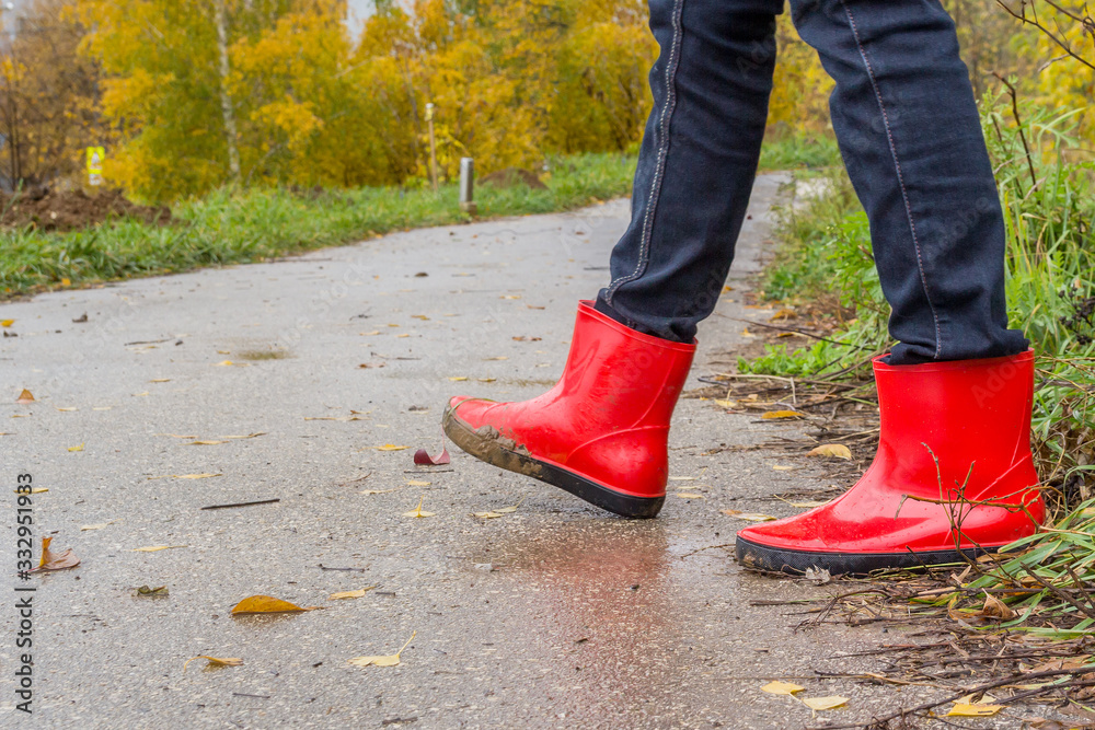 Walking in red rubber boots Walking in red rubber boots