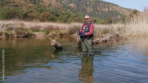 Hisaronu Orhaniye, Marmaris - Mugla / Turkey. March 12, 2020. Fisherman at river in Hisaronu. photo