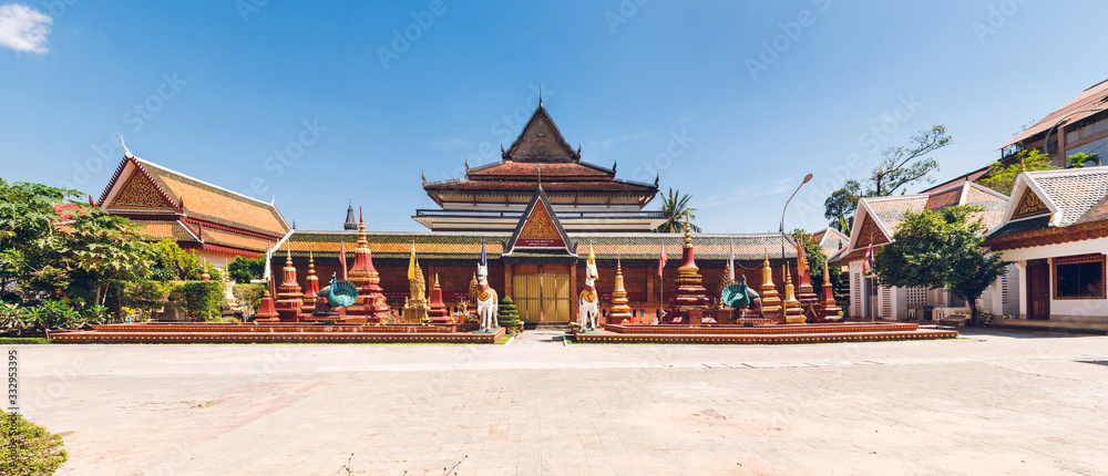 Naklejka premium Wat Preah Prom Rath. Buddhist temple complex with gardens. Siem Reap, Cambodia. Panorama.