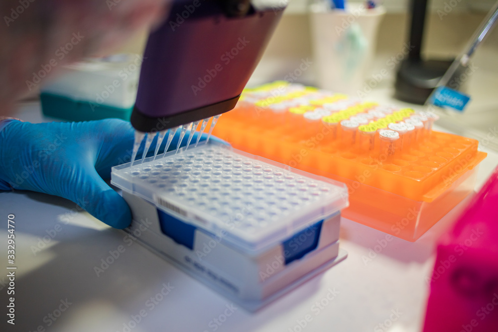 Close up image of laboratory instruments being used to test vaccines and drugs for viruses and DNA Close up image of laboratory instruments being used to test vaccines and drugs for viruses and DNA