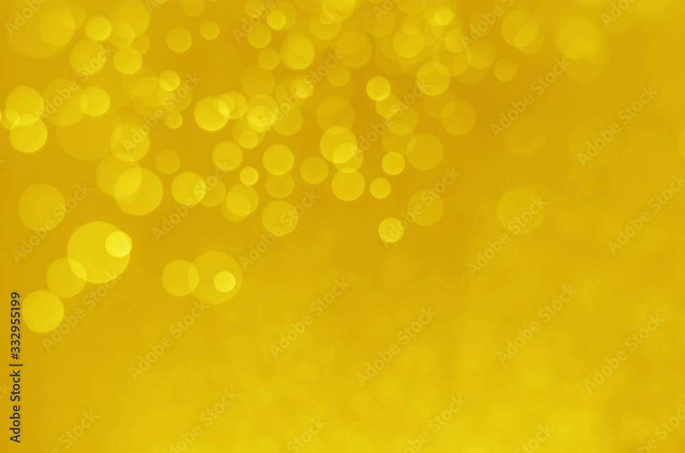 abstract yellow bokeh glitter sparkle background.