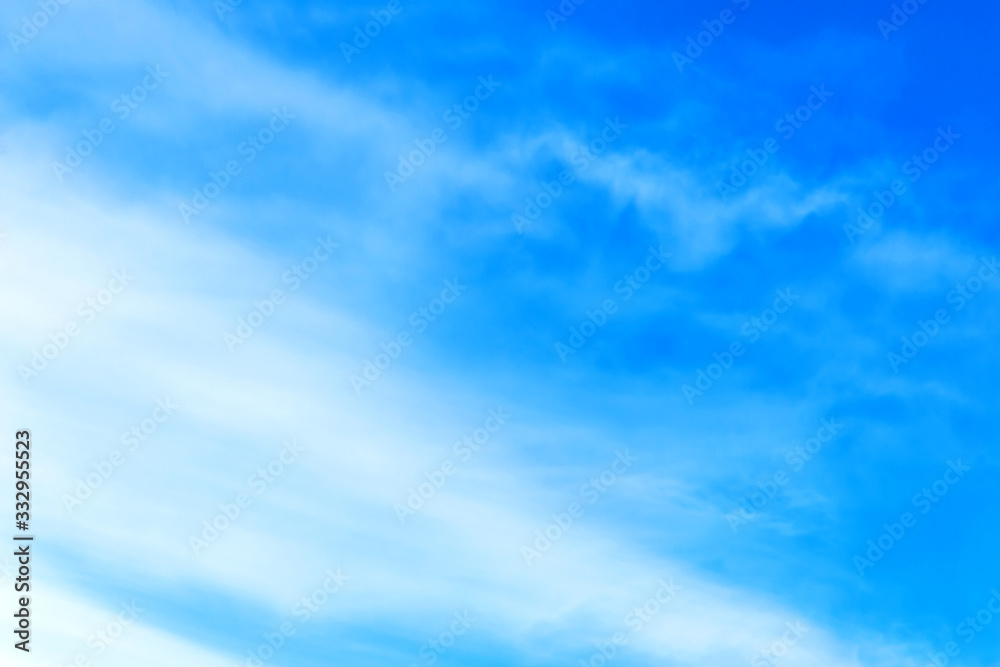 white cirrus clouds in the blue sky. Abstract background. white cirrus clouds in the blue sky. Abstract background.